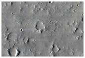 Craters on the Edge of Labeatis Fossae