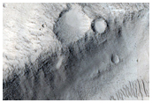 Elongated Crater North of Tartarus Montes
