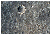 Crater Ejecta Material in Contact with Mesas and Buttes
