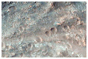 Impact Crater Exposing Bedrock
