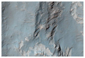 Pit with Rock Exposure Northwest of Hellas Region

