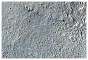 Small Craters and Channel on Large Crater Rim
