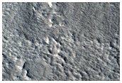 Layered Mesa in Crater in Galaxias Fossae Region
