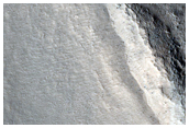 Crater in Valley Floor Material
