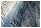 Layers in Pedestal Crater in Eumenides Dorsum Region
