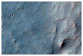 Channel Entering Crater in Northern Hellas Planitia
