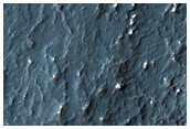 Small Hills or Blocks in Crater Ejecta Deposit
