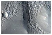 Valley Attached to Northern Mid-Latitude Crater
