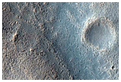Layered Feature in Crater in Hellas Montes Region

