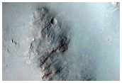 Stratigraphy of Crater Wall with Compositionally Diverse Ejecta
