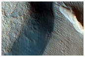 Dipping Layers along Outside Rim of Crater in Deuteronilus Mense

