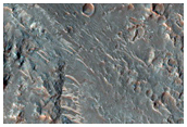 Phyllosilicates in Ejecta of Crater on Rim of Larger Crater
