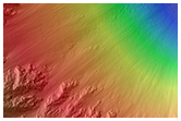 Oblique Impact Exposing Bedrock within a Libya Montes Massif