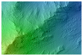Low Albedo Slopes along Coprates Chasma Ridge