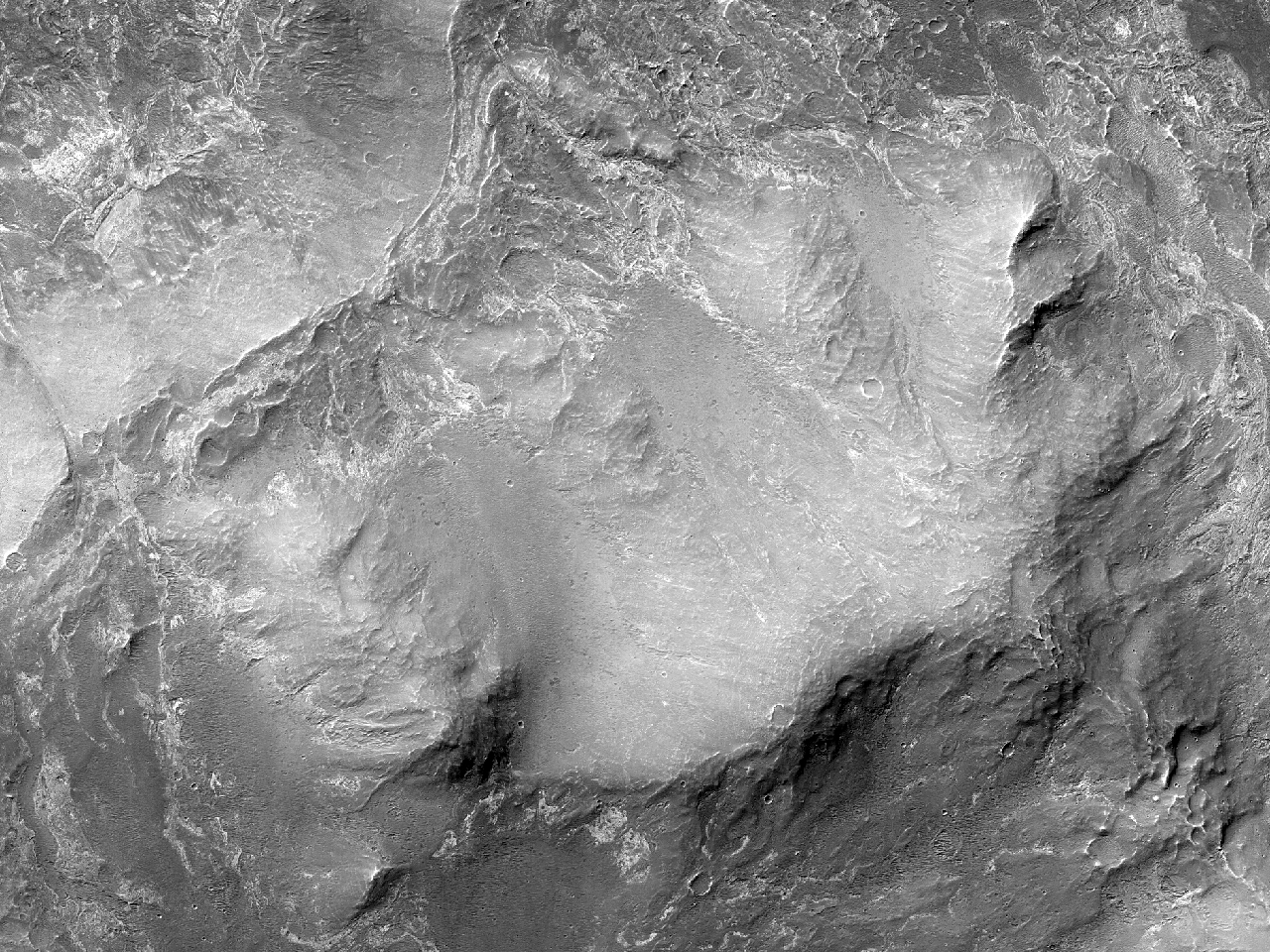 在西方梅拉斯查斯玛的环形凹陷 (Melas Chasma)
