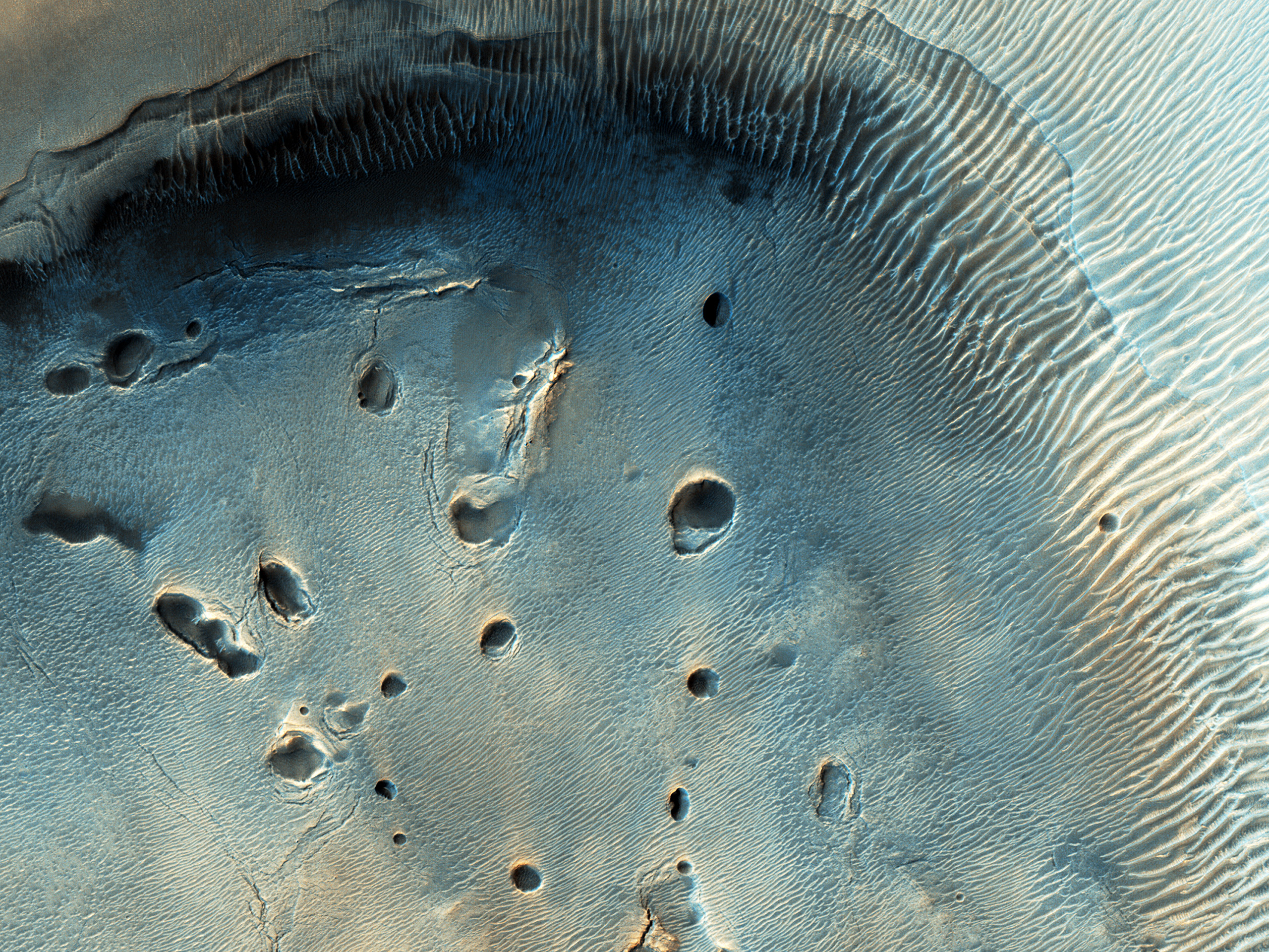 A Dark-Toned, Pitted Mound in Arabia Terra