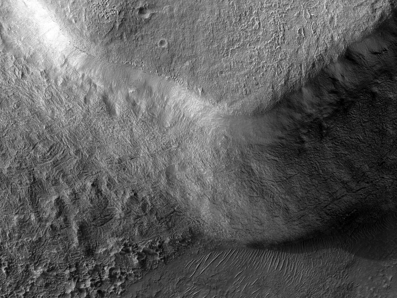 Interesa geologia formo al la nordokcidento de Hellas Planitia