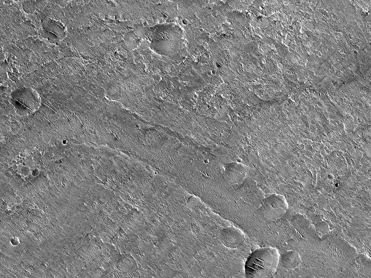 Canalisuperficiali vicino al cratere Orson Welles