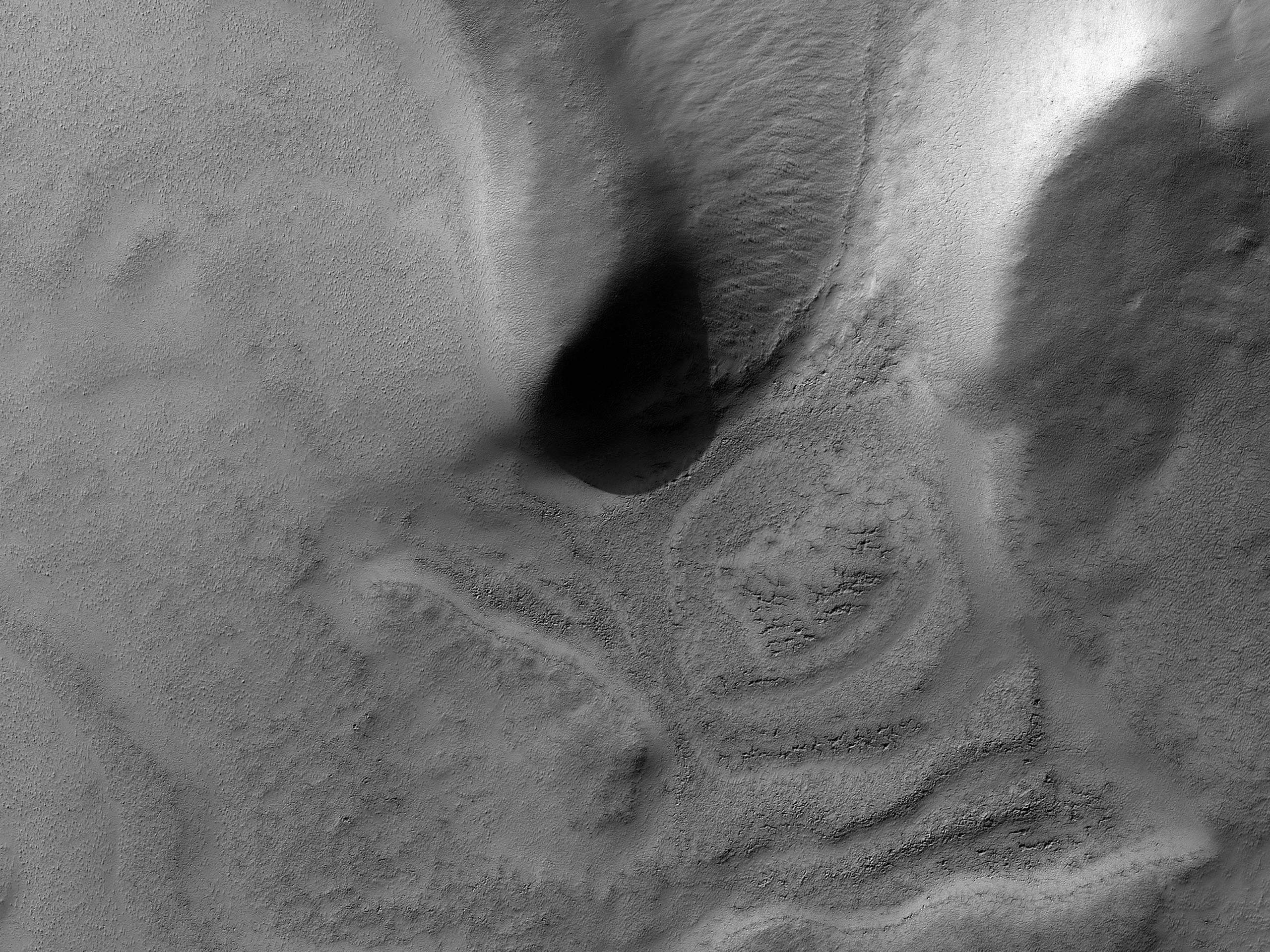 Depression Adjacent to Crater in South Polar Region