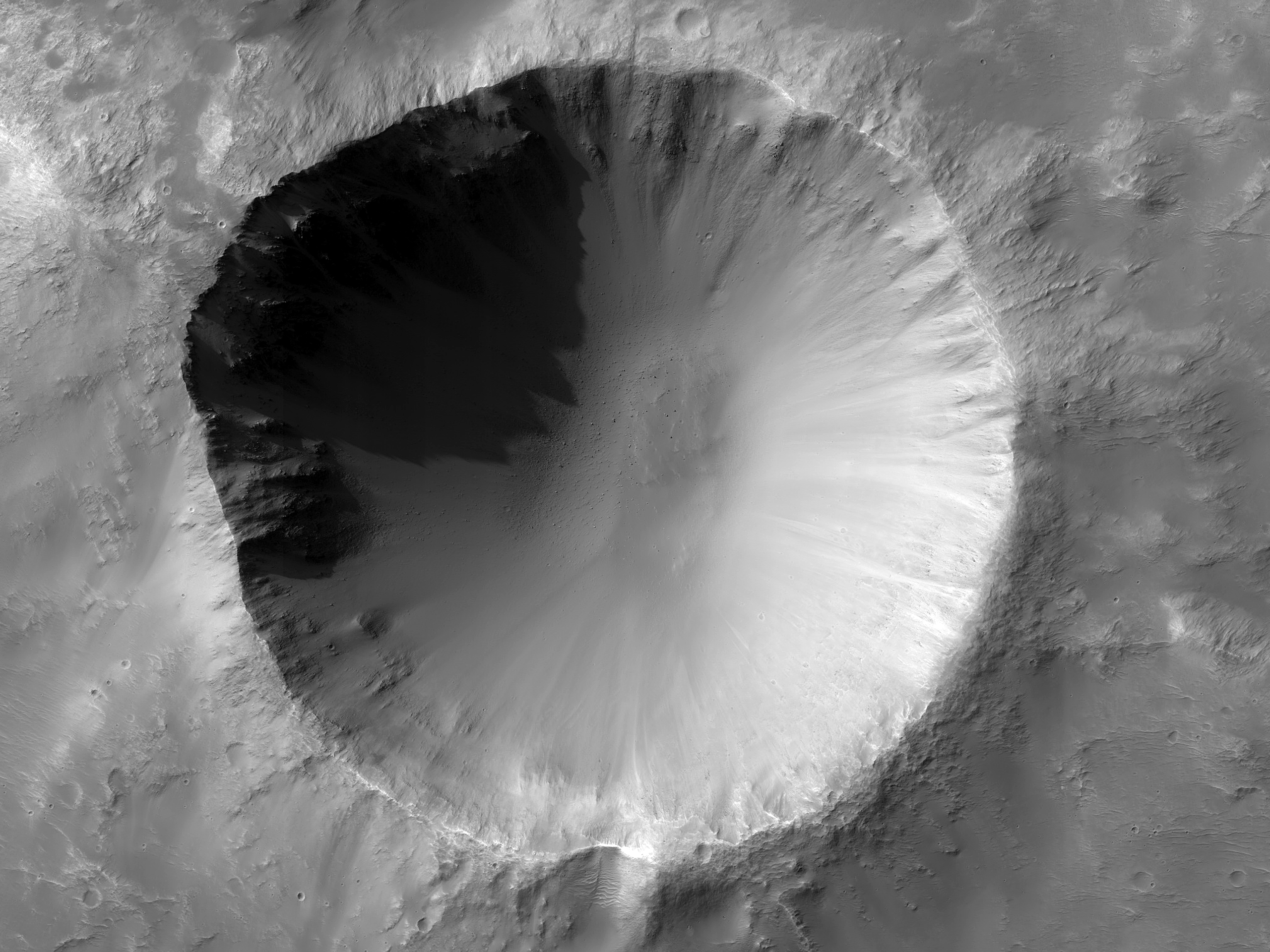 Crater Excavation of Uncommon Hydrous Minerals