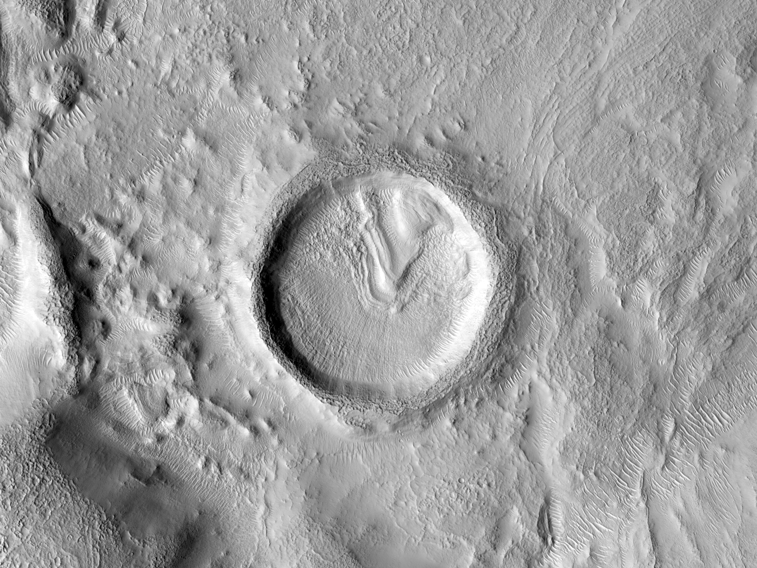 Flow Moving through Crater in Nilosyrtis Mensae