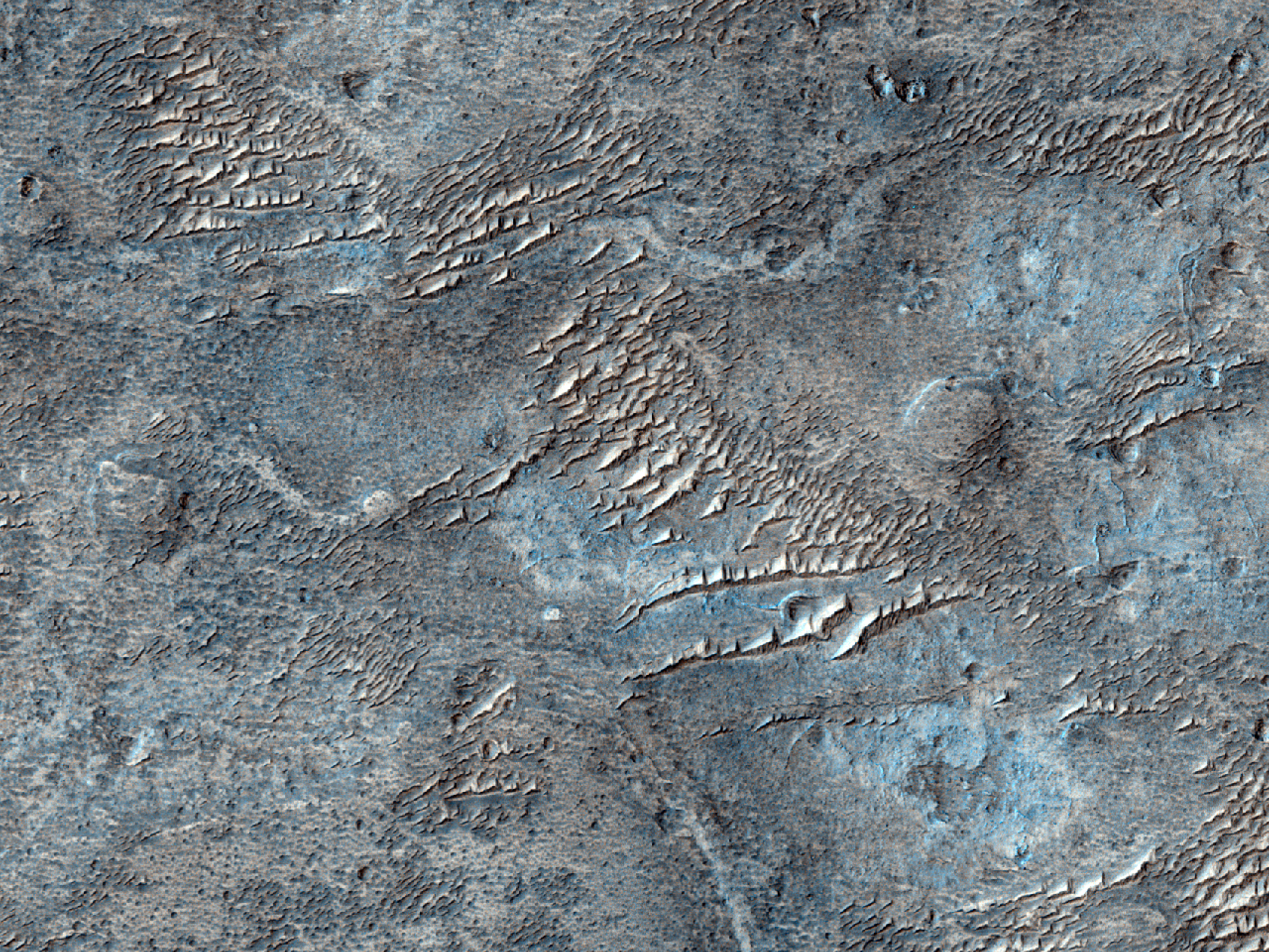 Exposed Material Southwest of an Impact Crater
