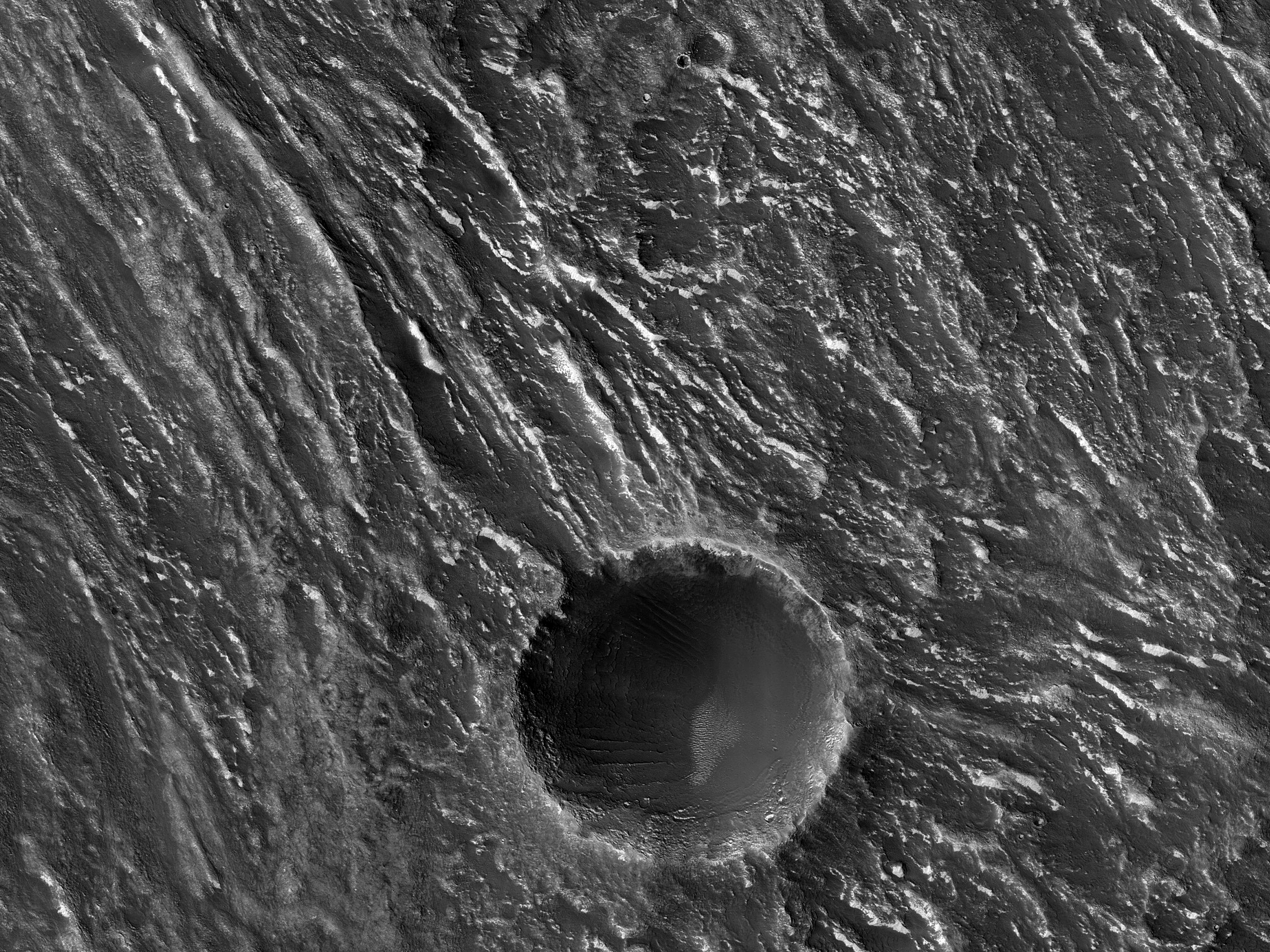 Close Ridges on a Crater Floor in Claritas Fossae