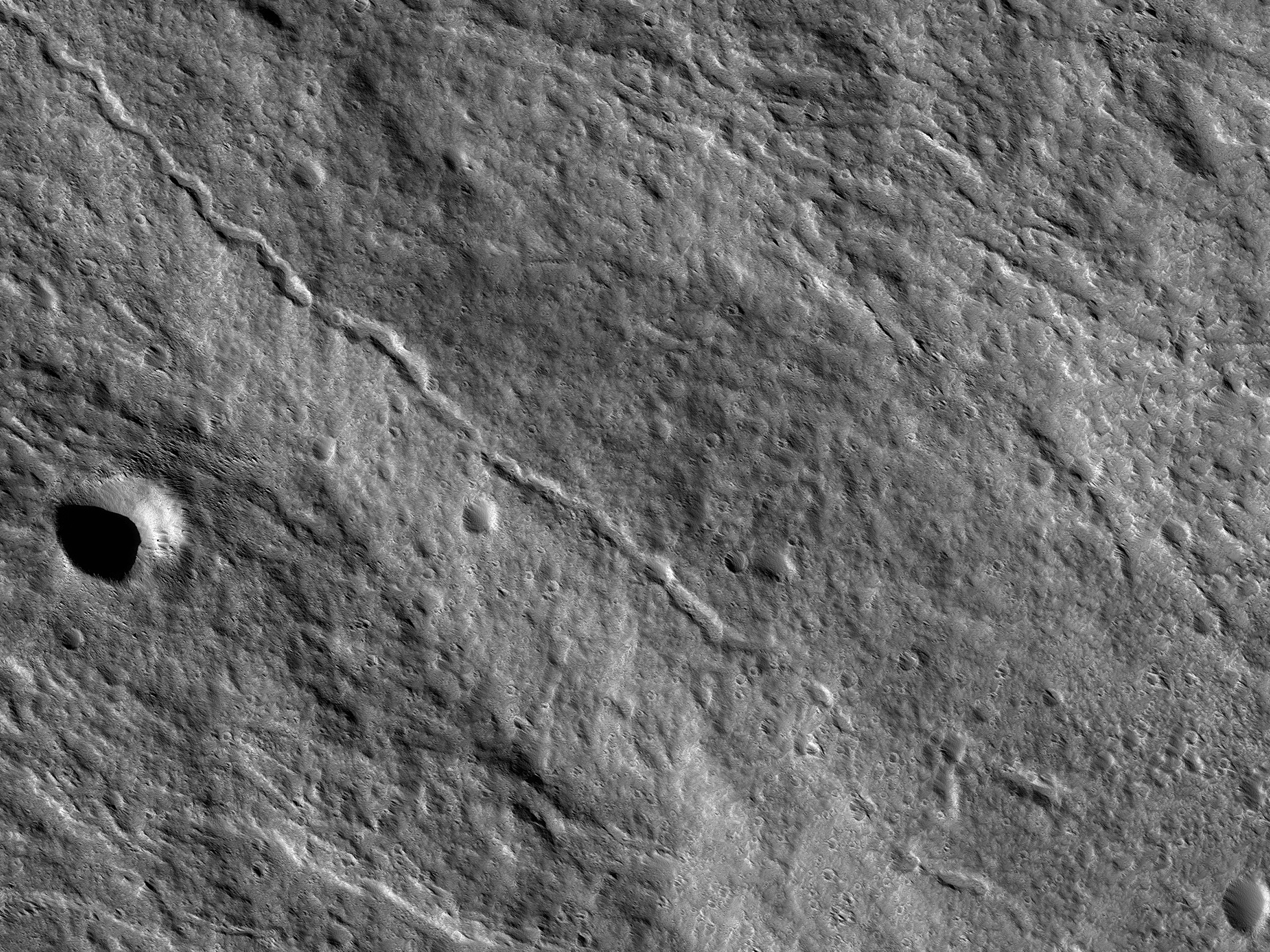 A Channel Cutting through Lava Flows on Olympus Mons