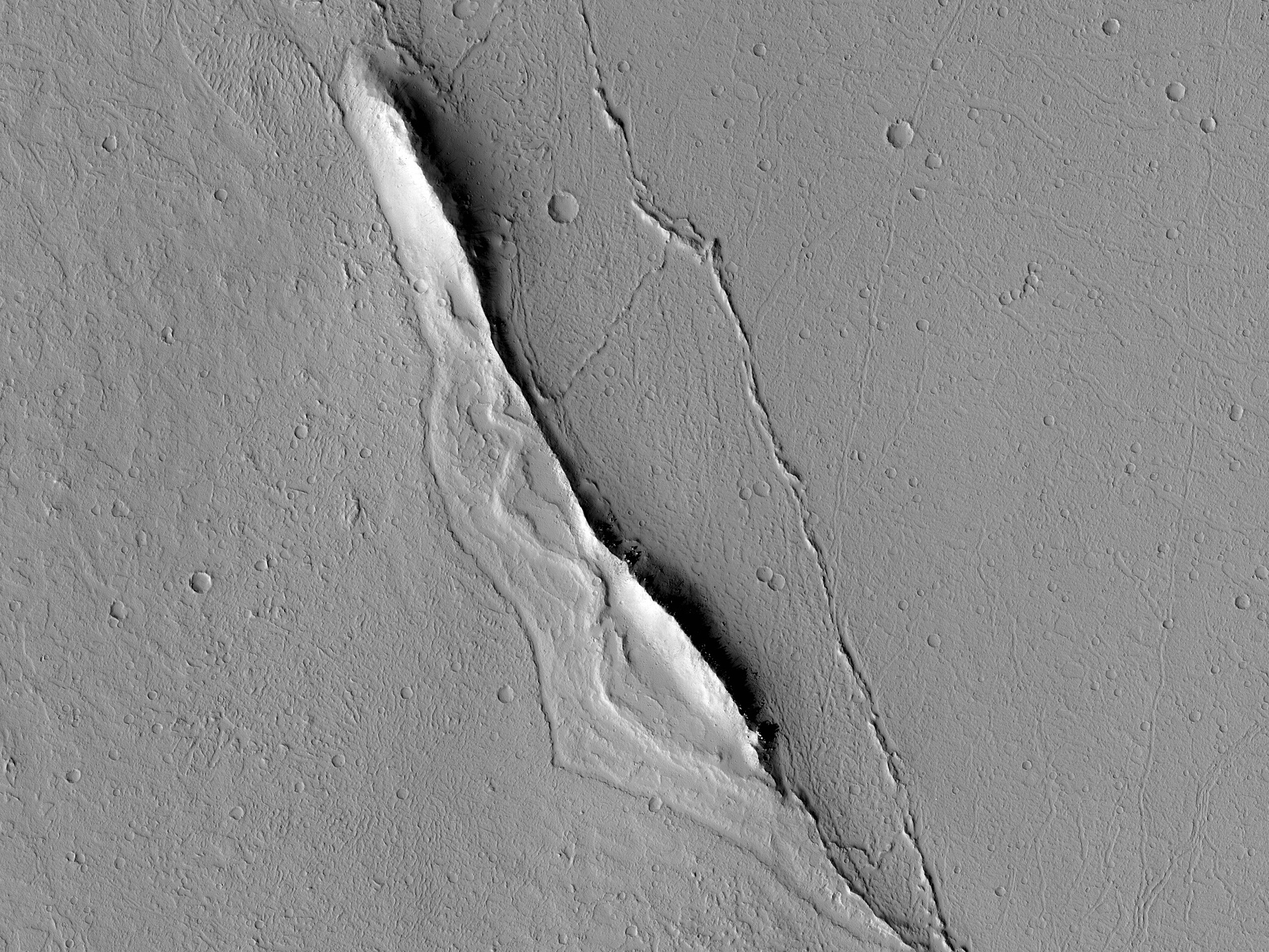 Ridge Standing above Lava Surface on Floor of Echus Chasma