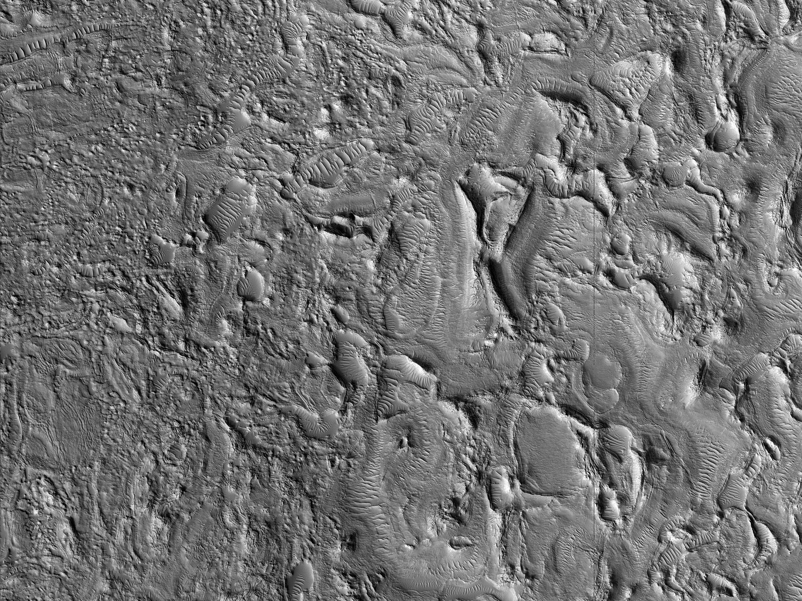 Ridges and Troughs in Crater Ejecta