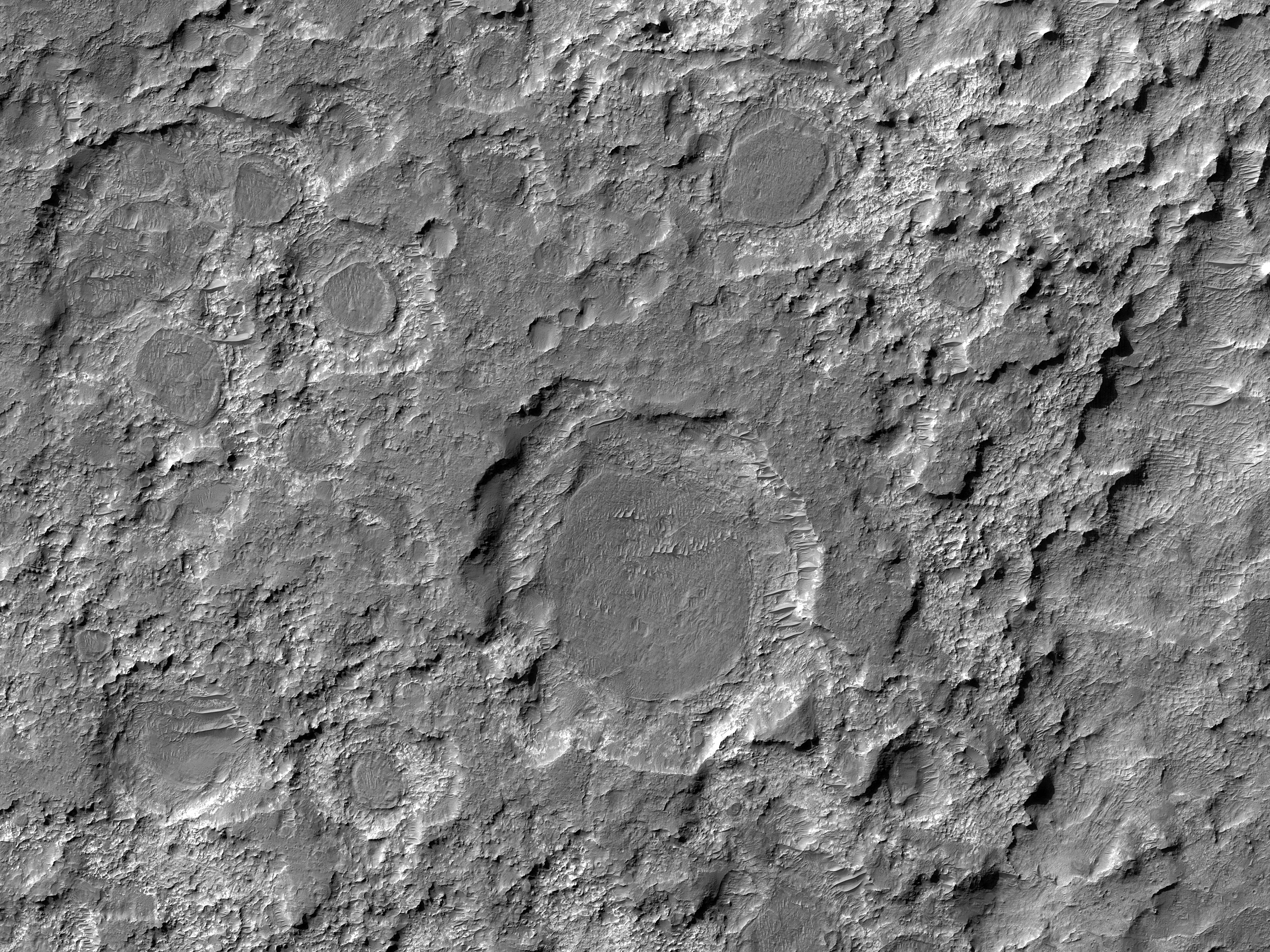 Dark Patches Formed by Craters
