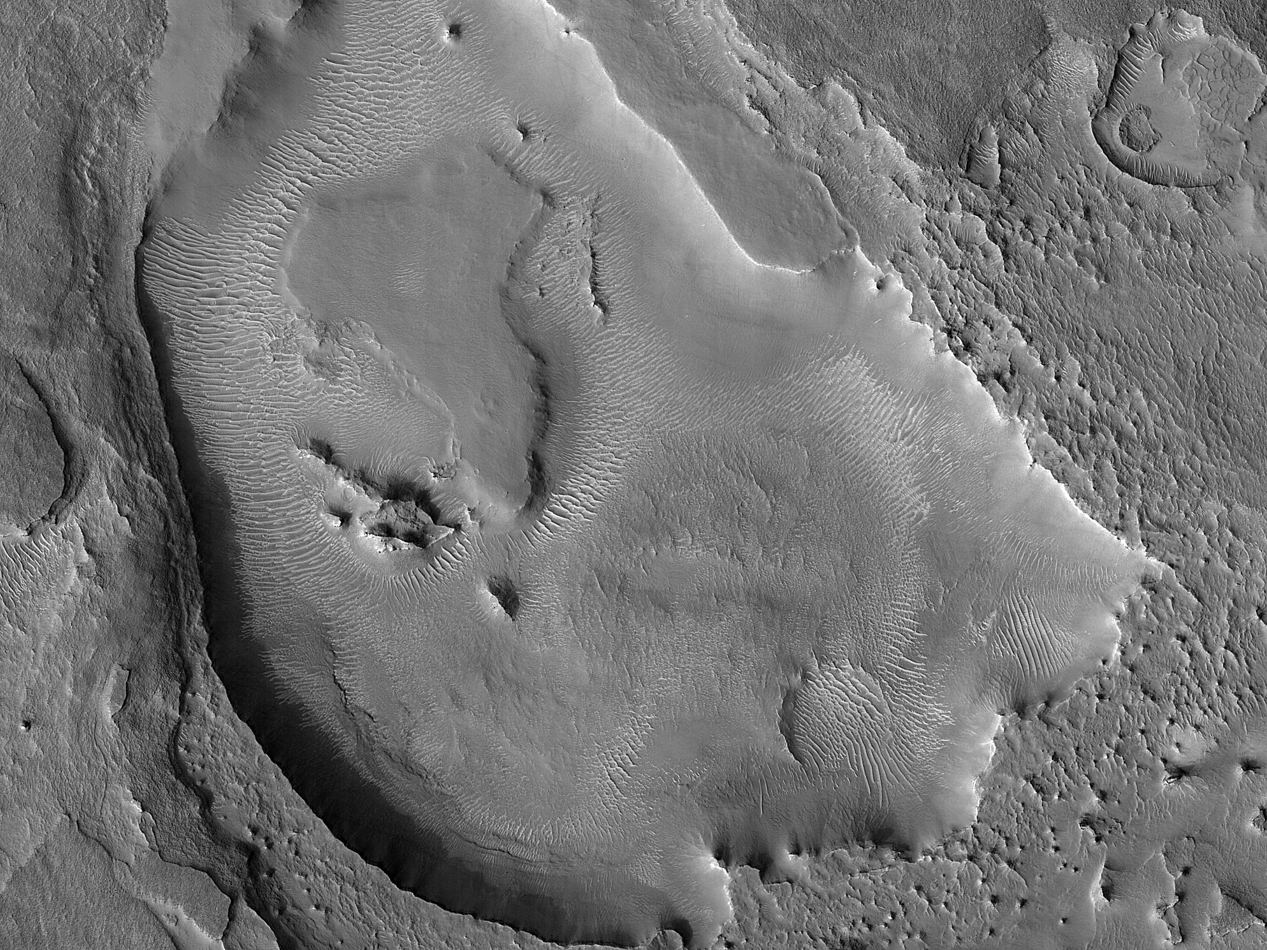 Layers in a Crater Depression near Auqakuh Vallis