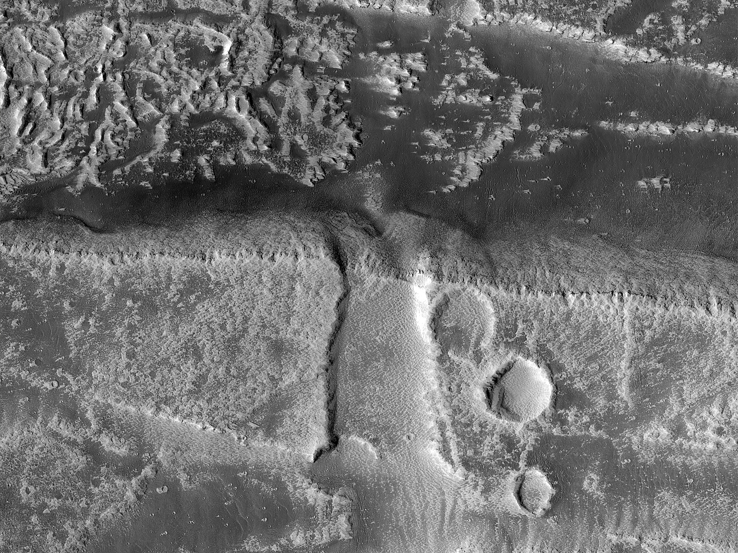 Contact between Distal Arsia Mons Lavas and Noctis Labyrinthus Grabens