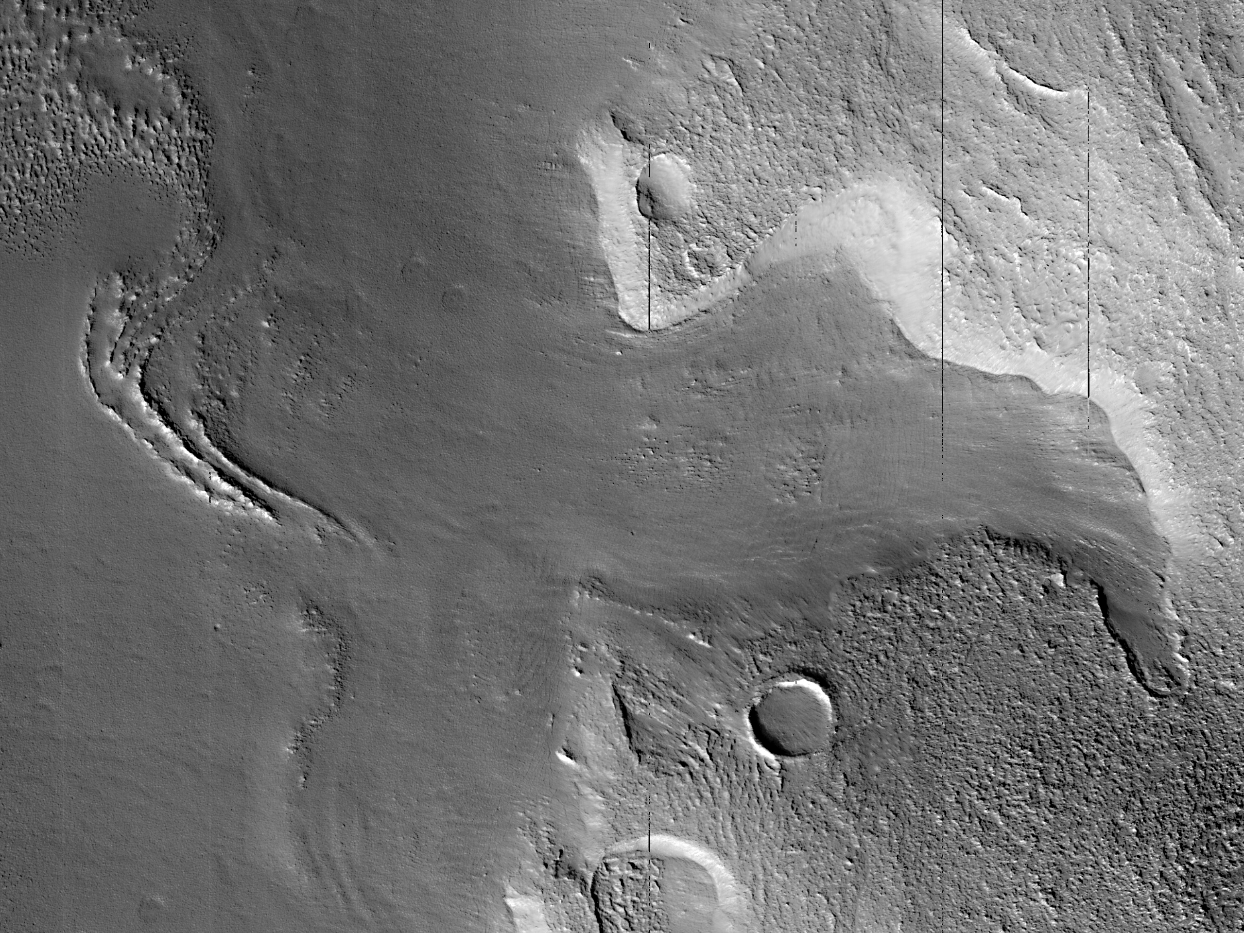 Flow Ridges near a Mesa in Protonilus Mensae