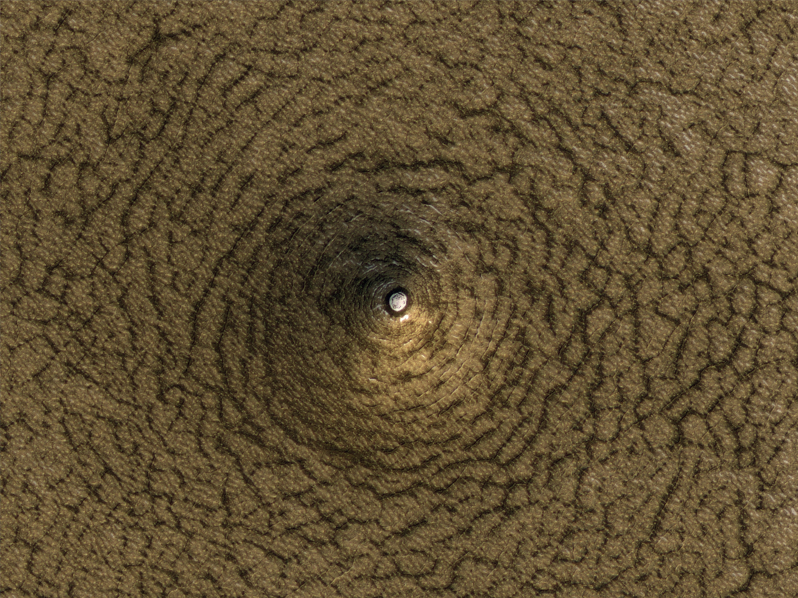A Cone-Shaped Pit on South Polar Deposits