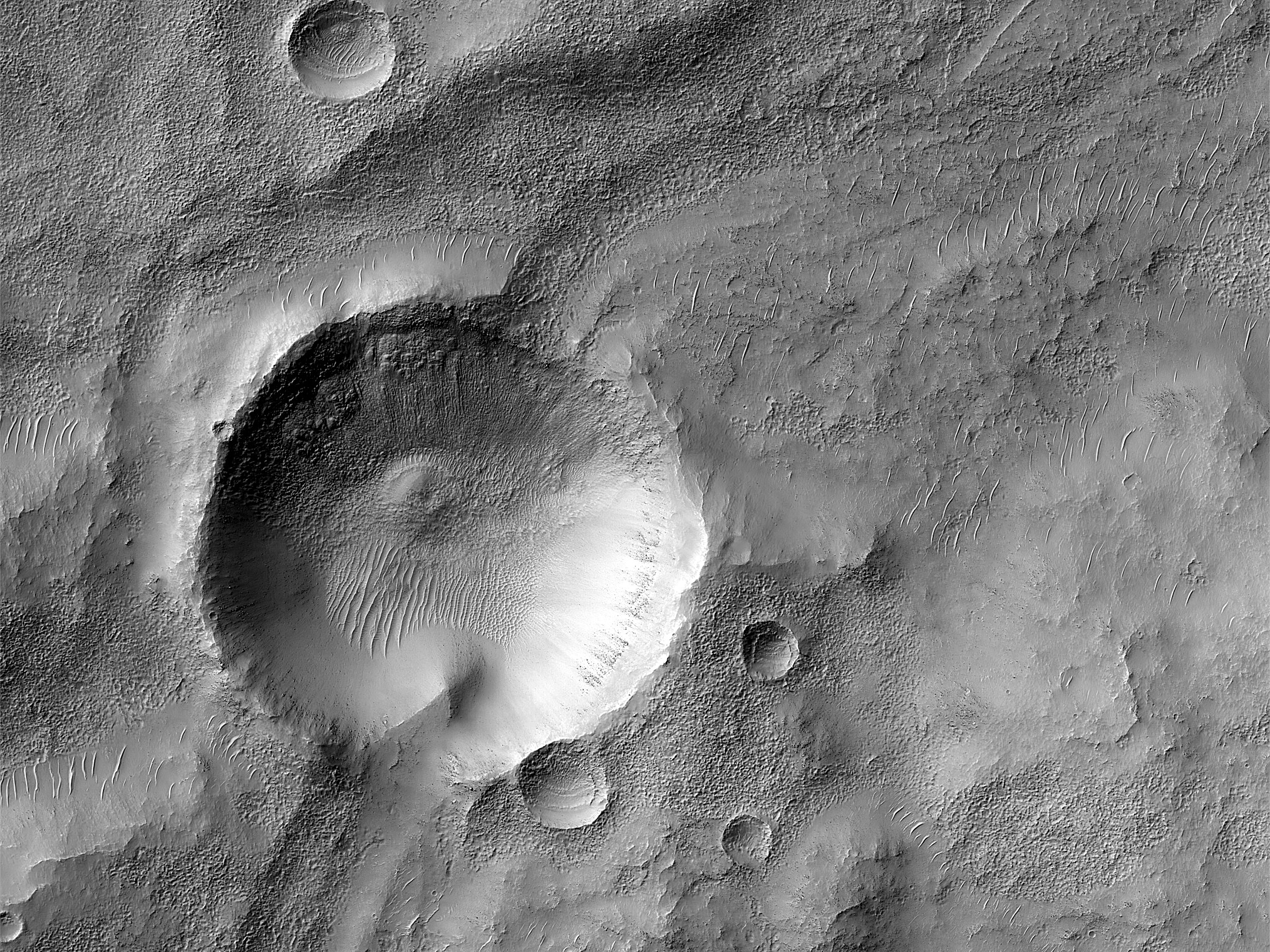 Channel Eroding Crater in Terra Sirenum