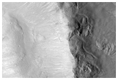 Gullies in South-Facing Slope of Crater, Plus Exposed Bedrock