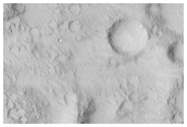 Crater Ejecta Blanket in Contact with Previous Small Crater