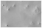 Ejecta from Crater Immediately East of This Location