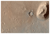 Crater in Western Arabia Terra with Stair-Stepped Hills and Dark Dunes