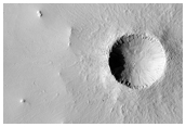 Crater and Extensive Field of Secondary Craters Seen in MOC Image R15-02146
