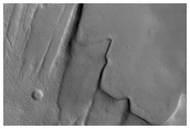 Aonia Planum: Geological Contact Between Layers
