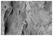Crater in Layered Deposits of West Candor Region 