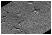 Swiss Cheese-Like Terrain Seen To Be Changing in MOC Imaging 