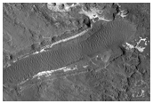 Light-Toned Rock Outcrops in/Near MOC Image R09-00101 North of Sigli Crater