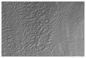 Lobate Deposit and Mesa Near Reull Vallis