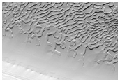 Exposure of Polar Layered Deposits Not Observed by Mars Global Surveyor