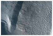 Possible Collapsed Slab Along Walls of Mamers Vallis