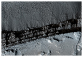 Olympica Fossae with Channel Breakouts