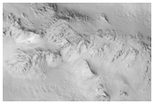 Well-Preserved Unnamed Crater Near Tartarus Region